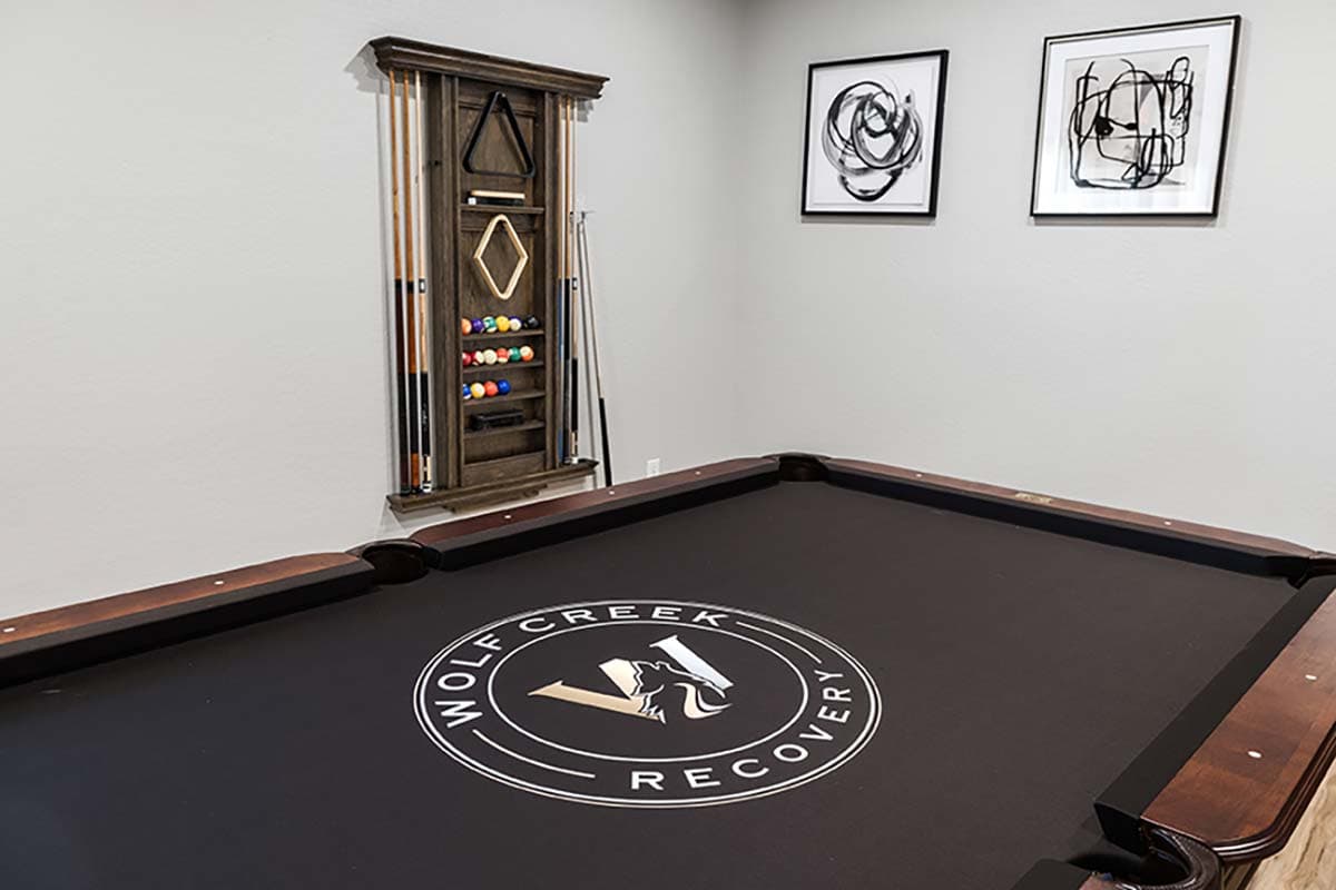 Pool table room at Wolf Creek Recovery